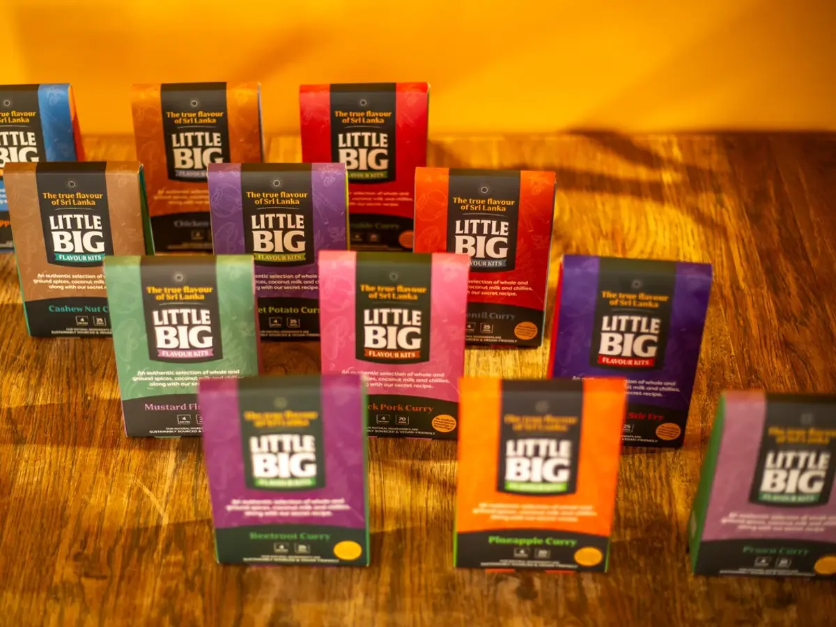 Colourful Little Big spice flavour-kit packages arranged on a wooden table